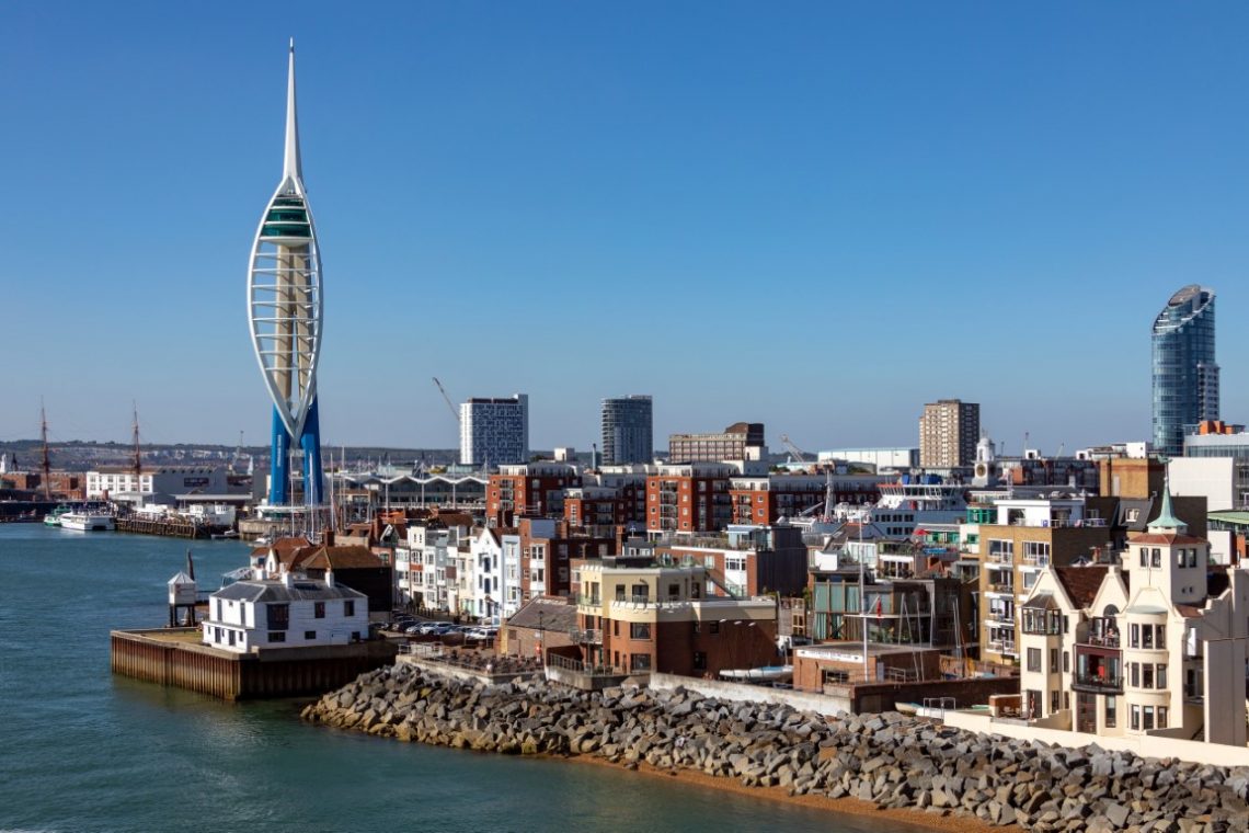 The harbor area and Spinnaker Tower in the city of Portsmouth on the south coast of England in the United Kingdom.